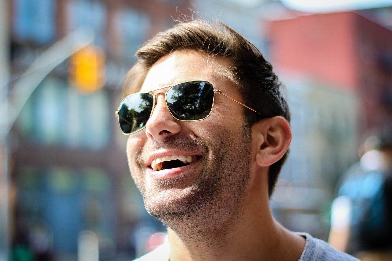 Smiling man wearing sunglasses
